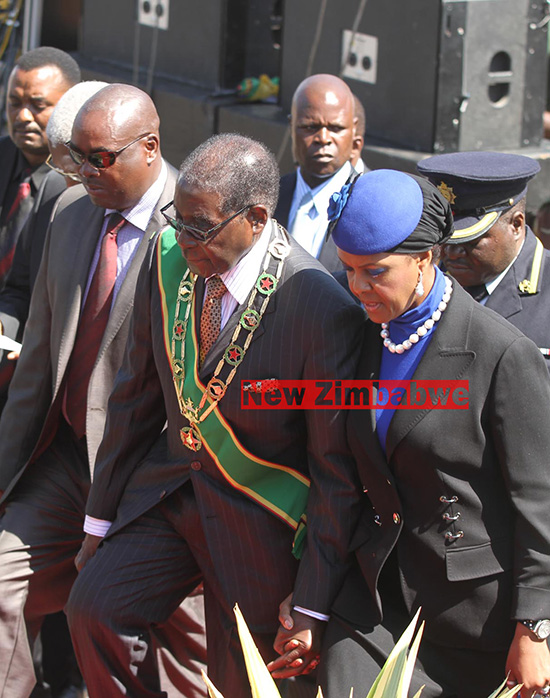 Grace Aids  Struggling 91 Year Old Mugabe,Up & Down Podium At Judge  Mutema’s Funeral.
