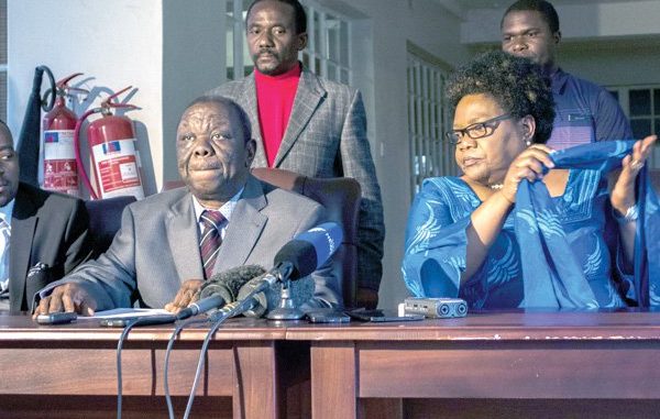 MUJURU reportedly dumps Mr Tsvangirai to sign a separate agreement with Biti .