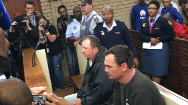 Verdict today in the trial of two white farmers who forced a black South African into a coffin while at the same time threatening to pour petrol over him and burn him alive