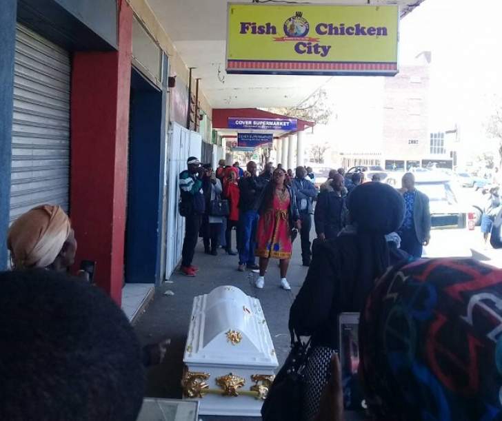 The late Mapecca relatives conduct a bizzare coffin ritual in Bulawayo city centre
