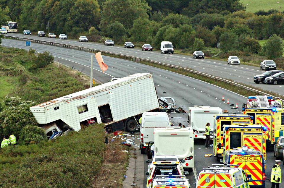 Four people have died after a lorry smashed through barriers and crashed into two opposite traffic cars on the M5 in Gloucestershire between junctions 15 and 14