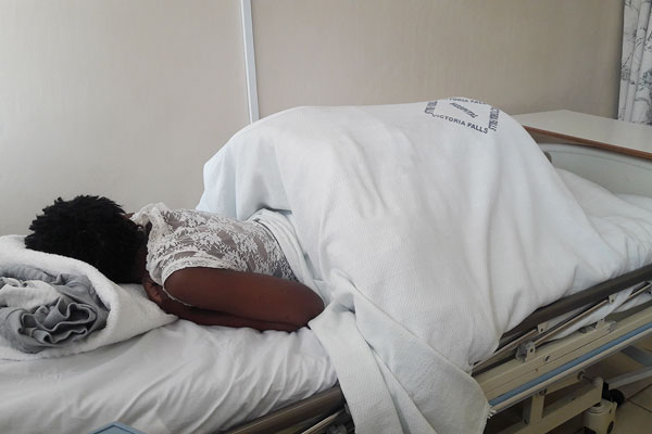 SEVEN months after cops forced woman to sit on an acid, Zibusiso Moyo is still battling for her life and says she has lost hope of completely healing as the wound has remained septic.