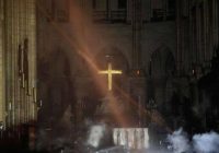 PHOTO: NOTRE DAME CROSS UNTOUCHED AND GLOWING in inferno that damaged the medieval building.